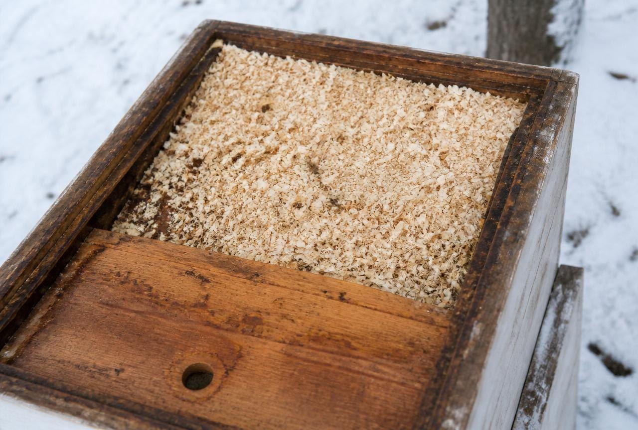 A Quilt Box Filled With Wood Shavings Insulating A Winter Hive