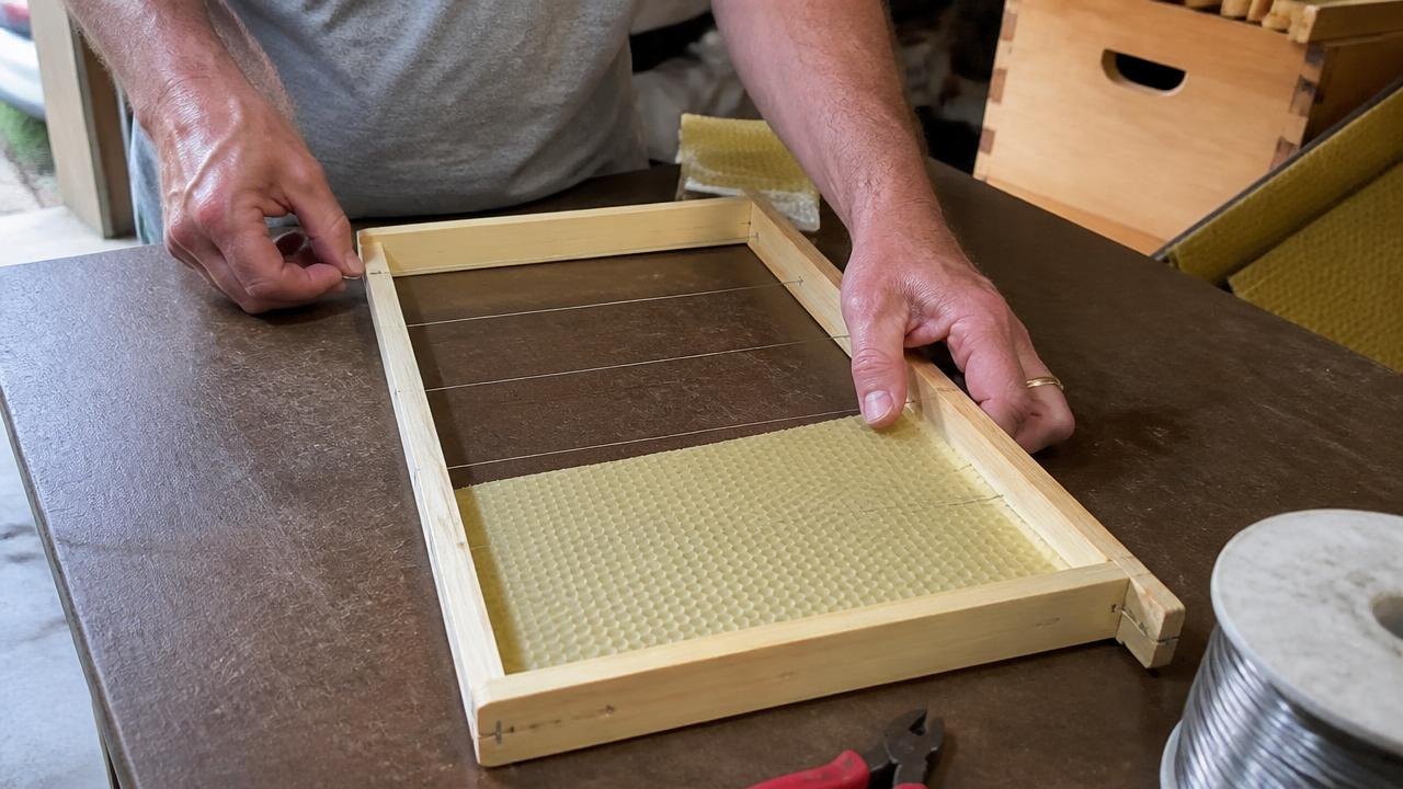 Wiring A Wooden Frame And Embedding A Sheet Of Beeswax Foundation